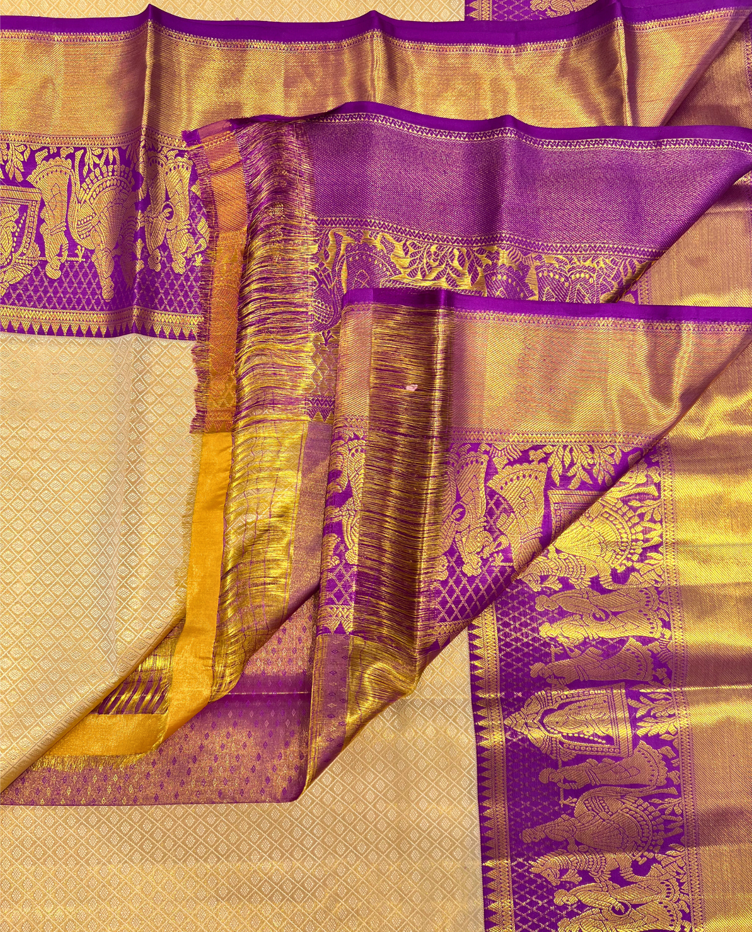 Golden Kanchipuram Silk Saree with Purple Border and Traditional Temple Motifs